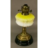 A VICTORIAN BRASS AND GLASS OIL LAMP having a Duplex burner, moulded opaque glass reservoir and