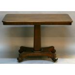 A 19TH CENTURY MAHOGANY PEDESTAL TEA TABLE having a rounded rectangular top, canted and tapering