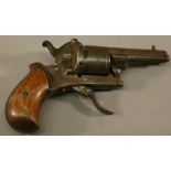 A BELGIAN SIX SHOT REVOLVER having wooden grips and folding trigger, the barrel marked with Leige