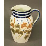 AN EARLY 20TH CENTURY POTTERY JUG most probably by J MacIntyre, with banded neck , shallow spout,
