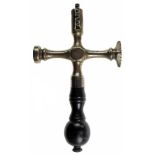 A LATE 18TH/EARLY 19TH CENTURY CRUCIFORM PASTRY JIGGER with brass wheel, lozenge-form and circular