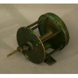 A BRASS 2 3/4" FISHING REEL of typical form. CONDITION: Used condition with some bending and
