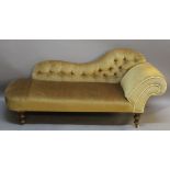 A VICTORIAN CHAISE LONGUE having a shaped and deep-buttoned back, scrolled arm and sprung seat,