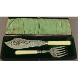 A CASED SET OF SILVER PLATED FISH SERVERS of traditional form with pierced and engraved