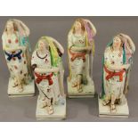 A GROUP OF FOUR STAFFORDSHIRE POTTERY FIGURES each a female depiction of hope standing beside an