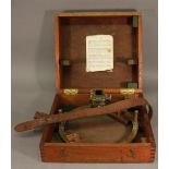 A MAHOGANY CASED BRASS AZIMUTH CIRCLE the top underside with paper instructions, marked with