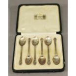 A CASED SET OF SIX LIBERTY & CO SILVER COFFEE SPOONS with stylised stems and ovoid bowls, marks