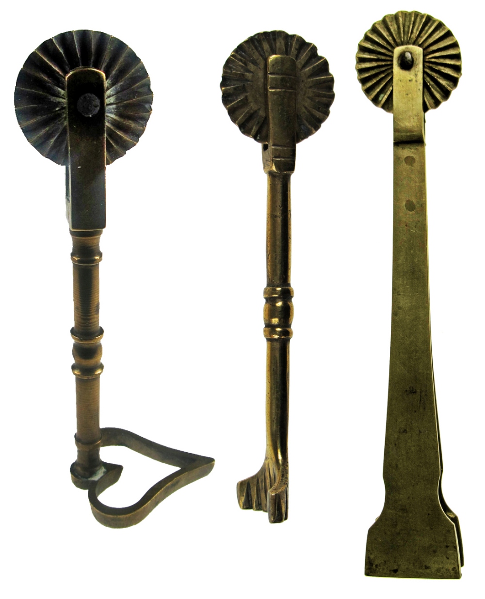 THREE 19TH CENTURY BRASS PASTRY JIGGERS, each with wheel, one having a heart-shaped cutter, 10.0cm