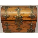 A LATE 19TH CENTURY WALNUT TEA CADDY of domed rectangular form with applied gilt metal mounts, the