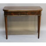 A 19TH CENTURY MAHOGANY FOLD-OVER TEA TABLE having rounded front corners and strung frieze with