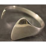 A GEORG JENSEN 925S BANGLE of shaped and open circular form, sold with Georg Jensen box. 6.5cm,