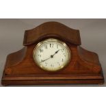 AN EARLY 20TH CENTURY INLAID MAHOGANY MANTEL CLOCK having an arched top, circular dial with Arabic
