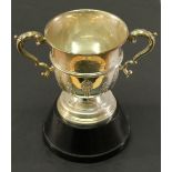 A GEORGE V SILVER 'PENRITH HOMING SOCIETY' TROPHY of cylindrical form with scroll handles, moulded