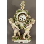 A 19TH CENTURY SITZENDORF PORCELAIN CLOCK formed with two opposing cherubs holding a flower