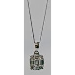 A WHITE METAL AND DIAMOND PENDANT, rectangular, baguette and brilliant-cut diamonds, unmarked but