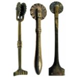 THREE EARLY 19TH-CENTURY BRASS PASTRY JIGGERS, comprising one with wheel and squared-off crimper,