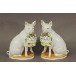 A PAIR OF CONTINENTAL PORCELAIN FIGURES of seated pigs holding woven baskets containing piglets,