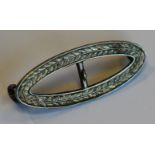 AN EDWARDIAN SILVER OVAL BUCKLE BY CHARLES HORNER, 3cm x 1.5cm, Chester 1911 (damaged), a