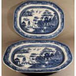 A PAIR OF EARLY 19TH CENTURY SPODE BLUE AND WHITE POTTERY ASHETTES transfer-printed in the willow