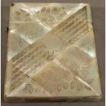 A VICTORIAN MOTHER-OF-PEARL CARD CASE of traditional form with engraved diagonal band and foliate