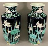 A PAIR OF JAPANESE POTTERY VASES of shouldered ovoid form, decorated with cranes among reeds and
