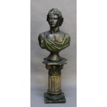 A PATINATED BRASS BUST possibly a depiction of Apollo Belvedere, with laurel wreath and robe 64cm(