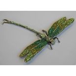 A LARGE COSTUME JEWELLERY DRAGONFLY BROOCH modelled with articulated wings and tail, set