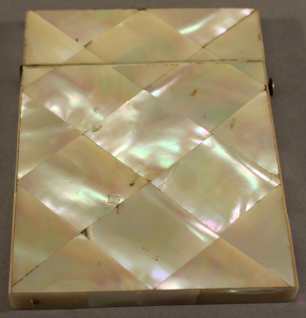 A VICTORIAN MOTHER-OF-PEARL CARD CASE of traditional form. 10cm x 7.5cm CONDITION: Good condition