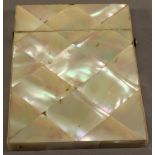 A VICTORIAN MOTHER-OF-PEARL CARD CASE of traditional form. 10cm x 7.5cm CONDITION: Good condition