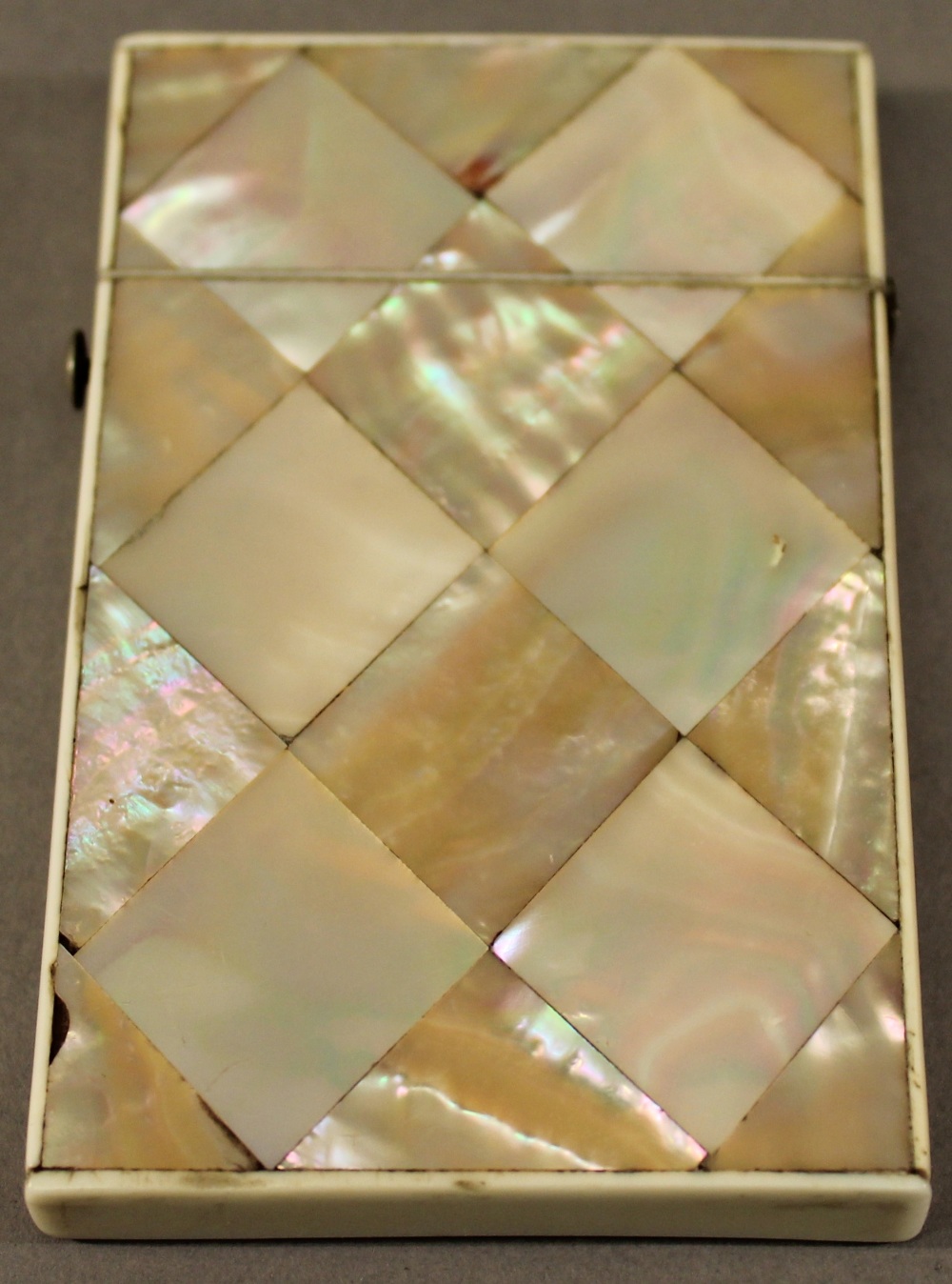 A VICTORIAN MOTHER-OF-PEARL CARD CASE of traditional form but smaller proportions. 9cm x 5.5cm - Image 2 of 2