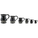 A SET OF SIX ENGLISH PEWTER BULBOUS TAVERN MEASURES of Quart, Pint, Half-pint, Gill, Half-gill and