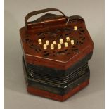 A TWENTY ONE KEY CONCERTINA ACCORDIAN marked 'English Trade Mark' & 'Steel Reeds' along with paper