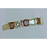 AN 18CT GOLD, DIAMOND AND RUBY HALF ETERNITY RING, a linear arrangement of round-cut rubies