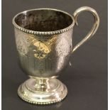 A 19TH CENTURY AMERICAN SILVER CHRISTENING MUG with beaded rim and scroll handle, the body