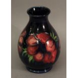 A MOORCROFT POTTERY 'ANEMONE' PATTERN VASE of baluster form, tube-lined with flowers and foliage