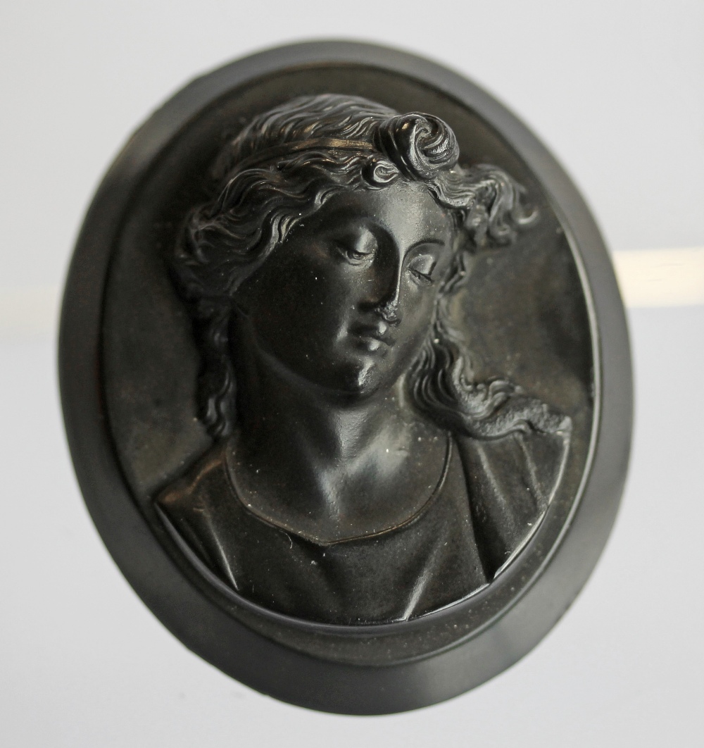 A VICTORIAN WHITBY JET CAMEO, carved with bust of a young woman, oval 5.5cm x 4.5cm, a ditto cameo