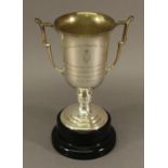 A GEORGE V SILVER 'THE PENRITH HOMING SOCIETY' TROPHY of upturned bell form with stylised handles,