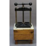 A CAST-IRON NIPPING OR BOOK BINDING PRESS by Harrold & Sons Ltd, London, 70cm(h) x 48cm(w) resting