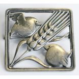 A GEORG JENSEN STERLING (925S) SILVER BROOCH of square form, decorated with two birds feeding on a