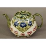 A MOORCROFT MACINTYRE POTTERY TEAPOT c1918-9 of spreading circular form tube-lined in the Florian