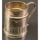 A QUEEN ANNE SILVER SMALL MUG of tapering cylindrical form with scroll decorated circular