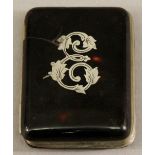 A 19TH CENTURY TORTOISESHELL PURSE of rounded rectangular form with inset white metal stylised