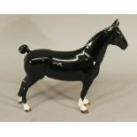 A BESWICK HACKNEY HORSE 'CHAMPION BLACK MAGIC' in black gloss, model 1361, gold coloured stamps.