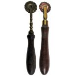 TWO 19TH-CENTURY PASTRY JIGGERS each having a single copper-alloy wheel and mount, with turned