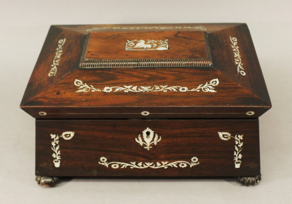 A VICTORIAN MOTHER-OF-PEARL INLAID ROSEWOOD JEWELLERY BOX of hinged sarcophagus form nicely inlaid