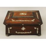 A VICTORIAN MOTHER-OF-PEARL INLAID ROSEWOOD JEWELLERY BOX of hinged sarcophagus form nicely inlaid