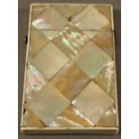 A VICTORIAN MOTHER-OF-PEARL CARD CASE of traditional form but smaller proportions. 9cm x 5.5cm