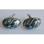 A PAIR OF GEORG JENSEN 925S AND HEMATITE CUFF-LINKS number 10, moulded with foliate decoration and