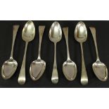 A GROUP OF SEVEN SILVER SERVING SPOONS, Old English pattern with pointed oval bowls, six with