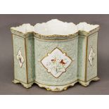 A COPELAND PORCELAIN JARDINIERE moulded with foliate and trellis designs, painted with shaped panels